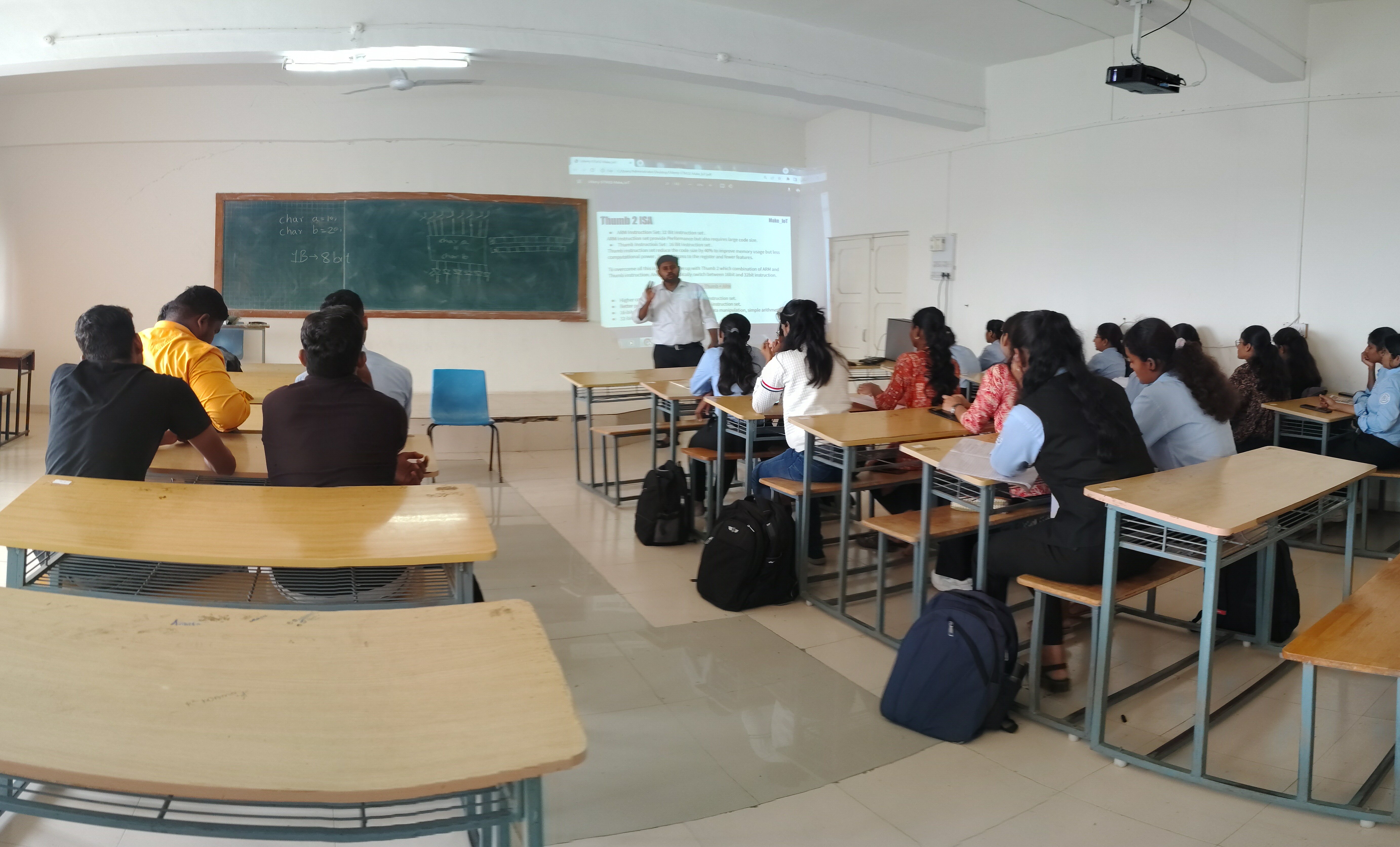 Engineering students working on laptops during an STM32 programming workshop