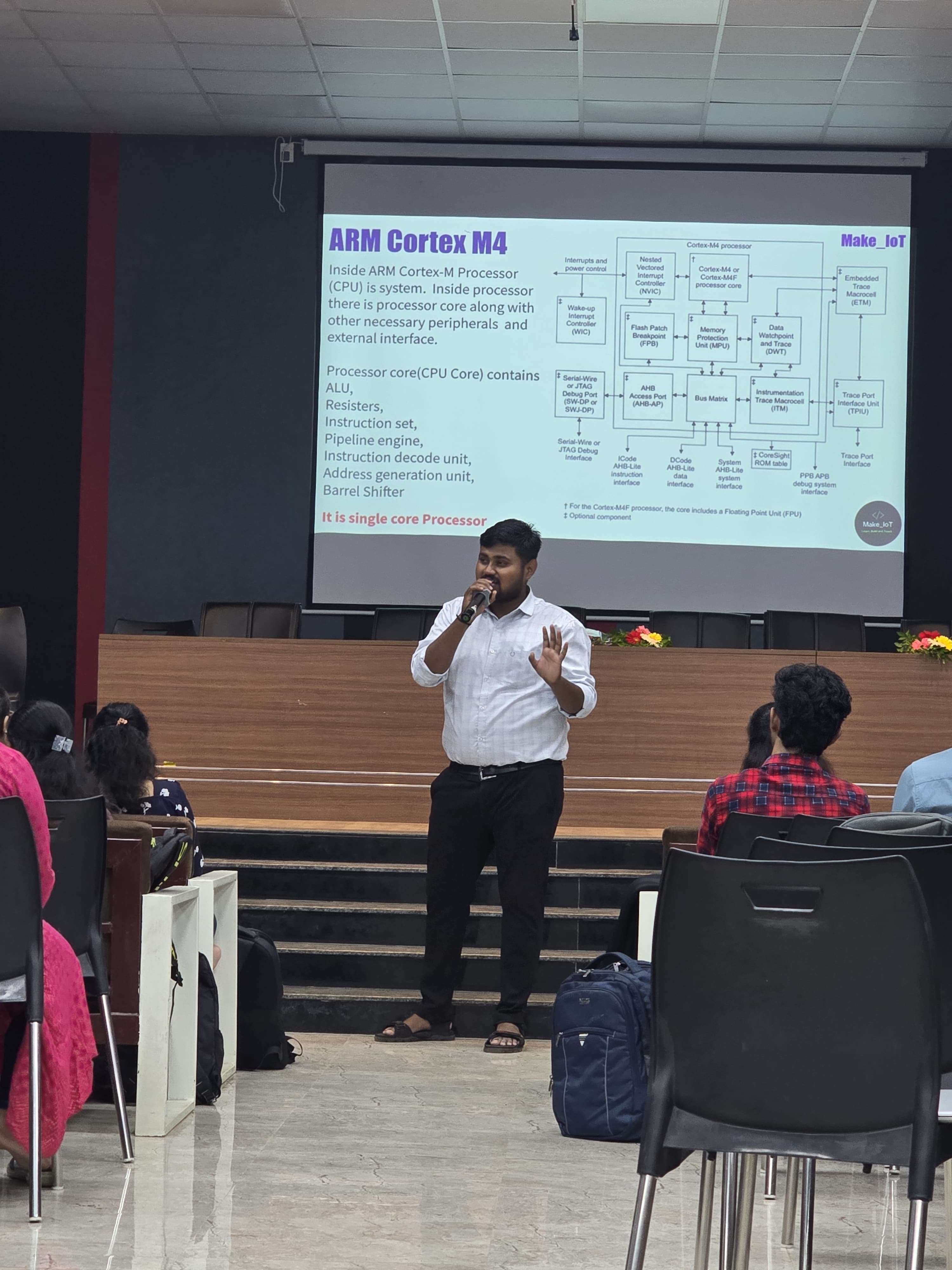 Instructor explaining ARM Cortex-M4 architecture during an embedded systems workshop