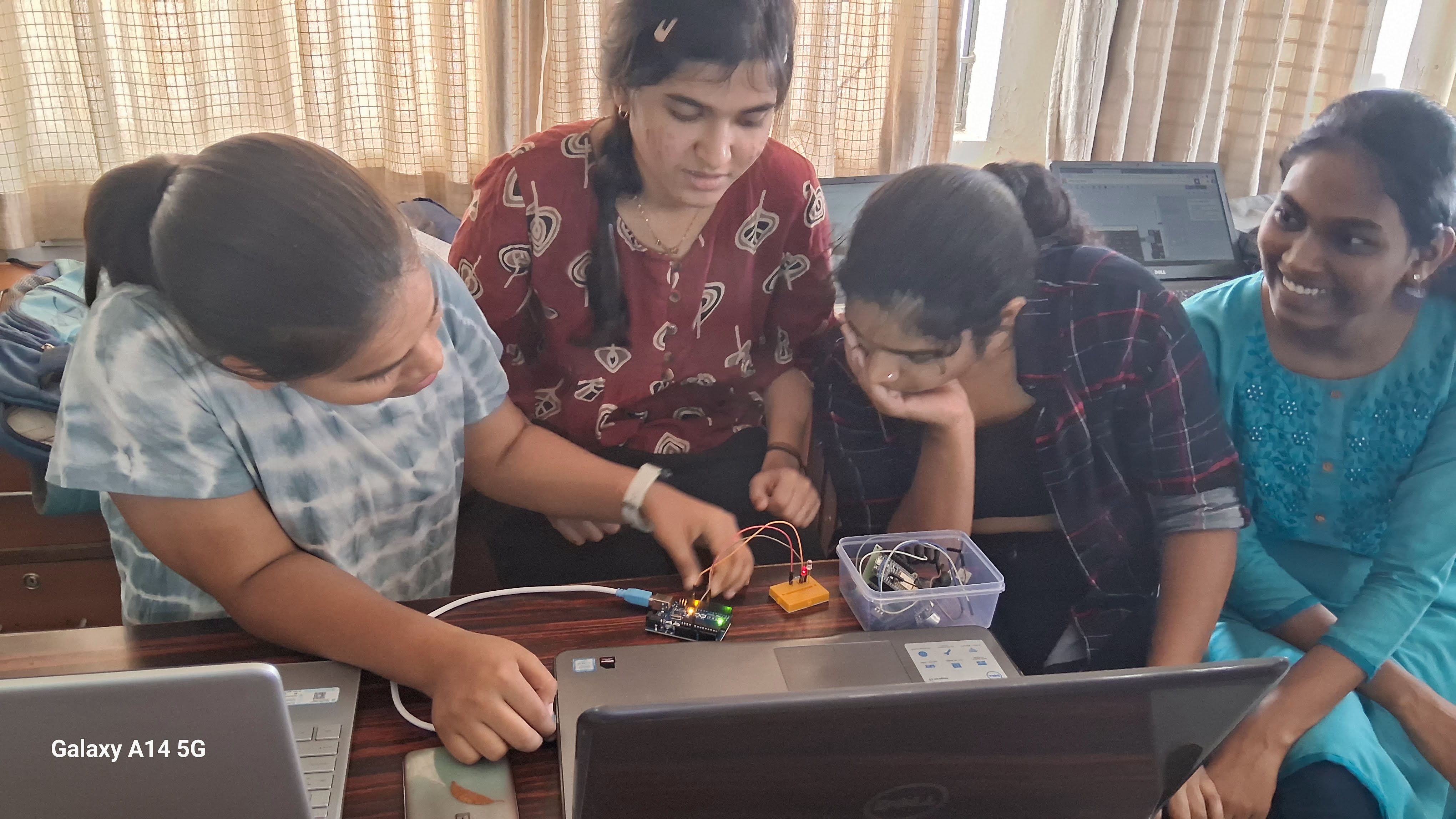 Engineering students working on Arduino and circuit hardware during a hands-on workshop at Sinhgad College of Engineering Pune