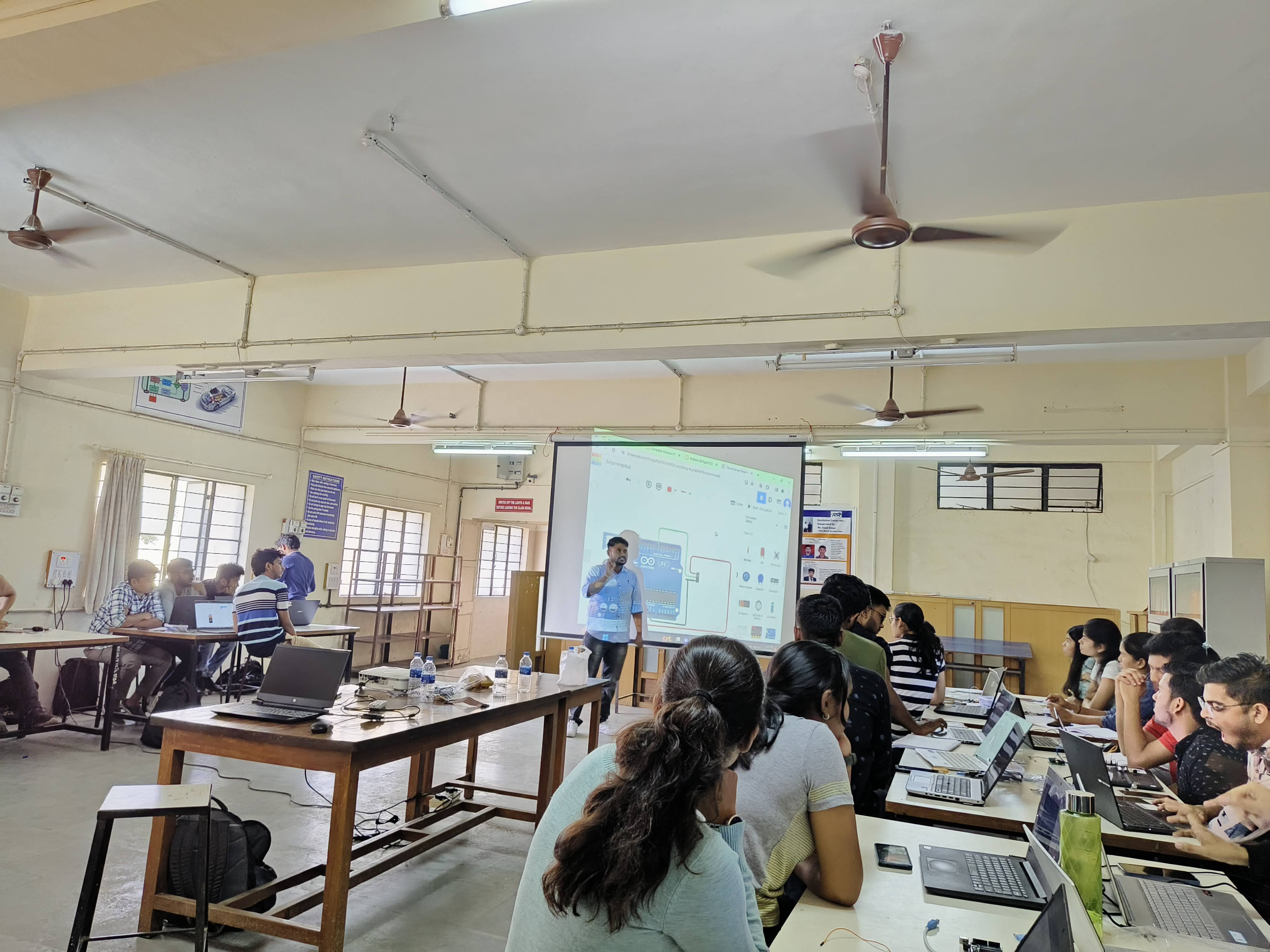 Arduino simulation explained and help to build projects for electronics students during an IoT workshop in Pune
